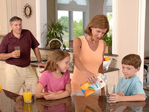 Family having orange juice