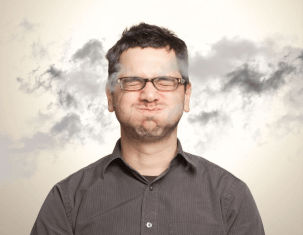 A homeowner holds his breath while surrounded by contaminated air.